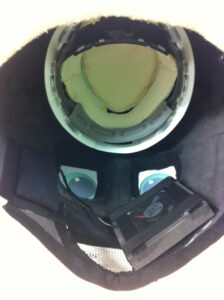 picture of the inside of a mascot head showing the helmet, fan and openings for eyes and mouth
